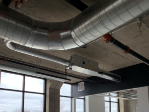 Ductwork and VAV Box hung from ceiling at the Rail Yard District